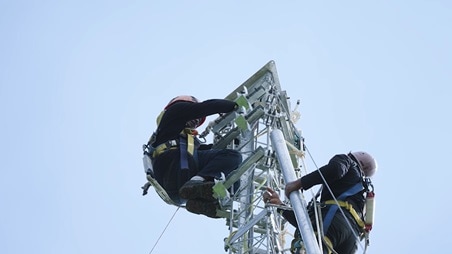 Technicians on tower